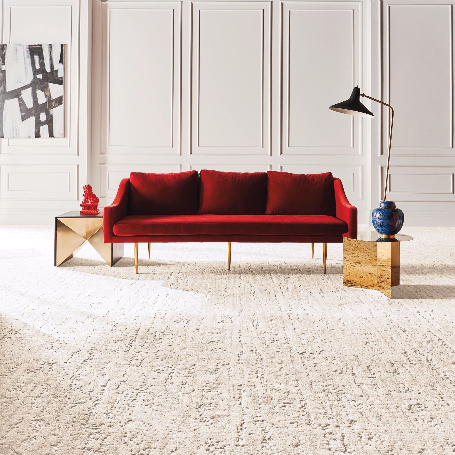 red couch on white carpet - Economy Carpet Inc